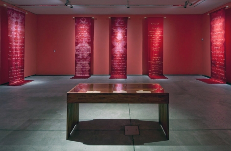 Reena Kallat, Walls of the womb, 2007, tied-and-dyed silk, handwritten recipe books,&nbsp;installation at&nbsp;Arken Museum in Denmark, Courtesy of Nature Morte, New Delhi, photo by Anders Sune Berg