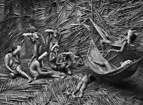 Women in the Zo&rsquo;&eacute; village of Towari Ypy color their bodies with the red fruit of the urucum,&nbsp;Par&aacute;, Brazil, 2009, gelatin silver print, 24 x 35 inches/61 x 89 cm