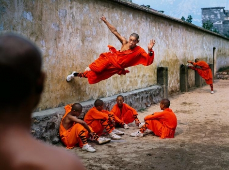 Steve McCurry, Monk Running on Wall, China, 2004, ultrachrome print, 40 x 60 inches/101.6 x 152.4 cm; &copy; Steve McCurry