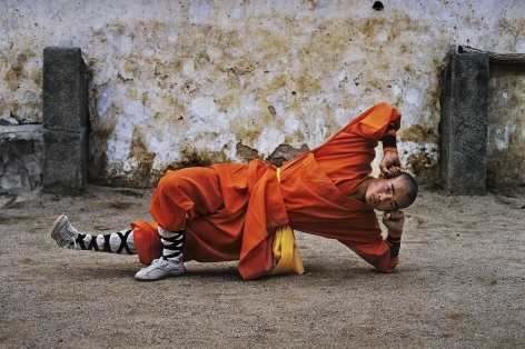 Young monk practicing Shaolin, one of the oldest styles of Kung Fu, Shaolin Monastery, Henan Province, China, 2004, chromogenic print, 20 x 24 inches/50.8 x 61 cm