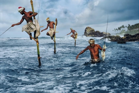 , Steve McCurry, Stilt fishermen, Weligama, South coast, Sri Lanka, 1995, ultrachrome print, 20 x 24 inches/50.8 x 60.96 cm; &copy; Steve McCurry