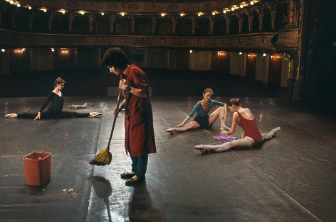 Man sweeps on stage while ballerinas stretch, National Ballet, Zagreb, Croatia, 1989, chromogenic print, 20 x 24 inches//50.8 x 61 cm